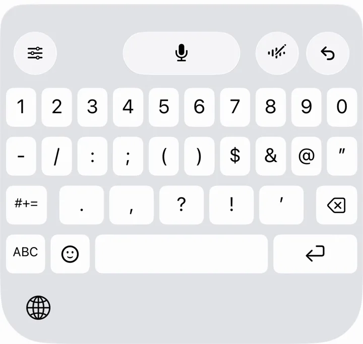 Teclado do Aqua com um botão de microfone no centro e a tecla do globo no canto inferior esquerdo.